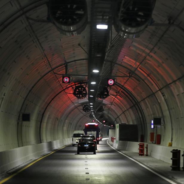 Cars drive through "Tahia Masr"  tunnel which passes under the Suez Canal, in Ismailia