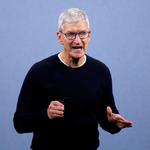 FILE PHOTO: CEO Tim Cook speaks at an Apple event at their headquarters in Cupertino