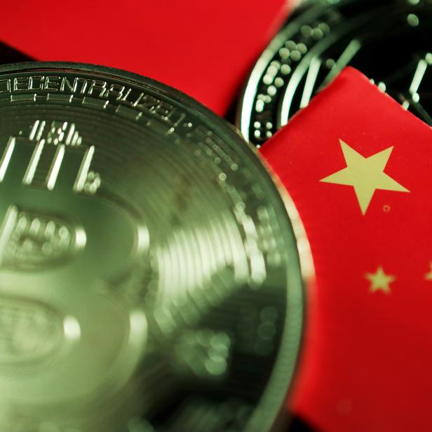 FILE PHOTO: Illustration picture of China flag and cryptocurrencies