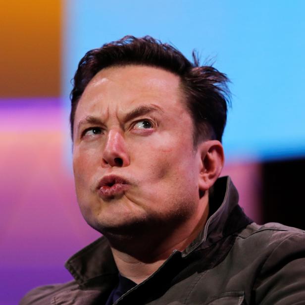 SpaceX owner and Tesla CEO Elon Musk reacts during a conversation with legendary game designer Todd Howard at the E3 gaming convention in Los Angeles