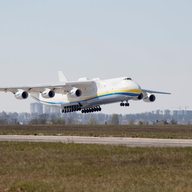 A cargo plane carrying medical equipment from China lands at an airfield outside Kiev