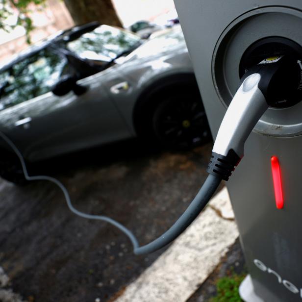 FILE PHOTO: FILE PHOTO: An electric car is plugged in at a charging point for electric vehicles in Rome