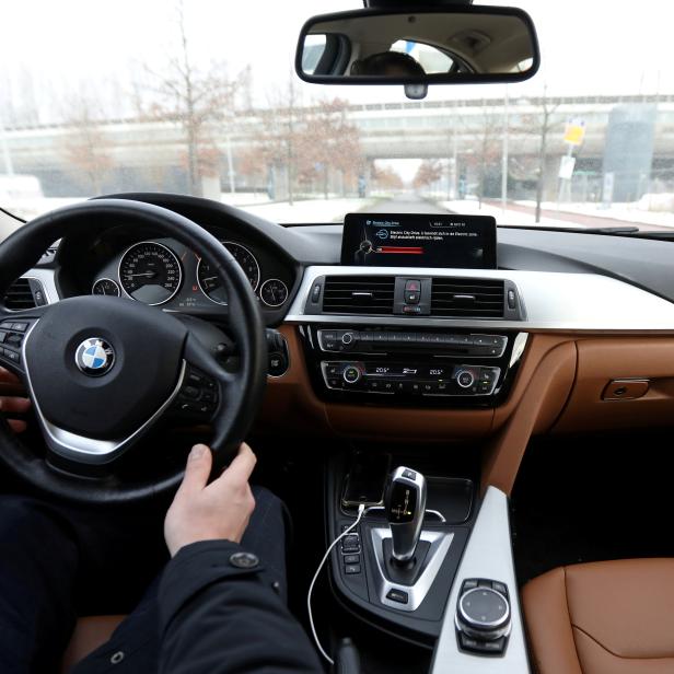 FILE PHOTO: Dashboard screen with an option to switch from petrol to battery is shown in Daan Hosli's BMW hybrid car, in Rotterdam