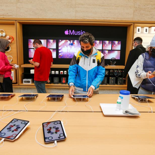 People check the products at an Apple store in Istanbul