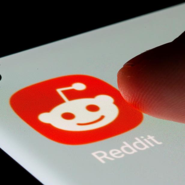 Reddit app is seen on a smartphone in this illustration