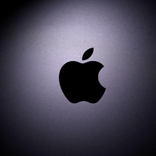 FILE PHOTO: Apple logo is seen on the Macbook in this illustration taken