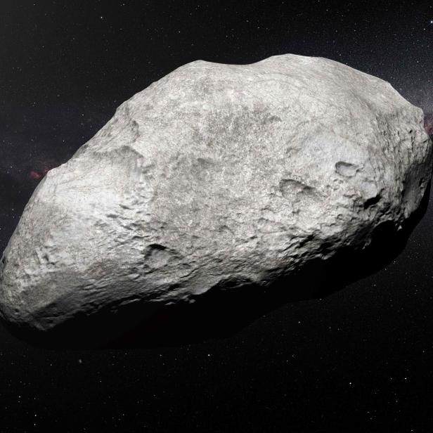 Ein großer, unregelmäßig geformter Asteroid im Weltraum.