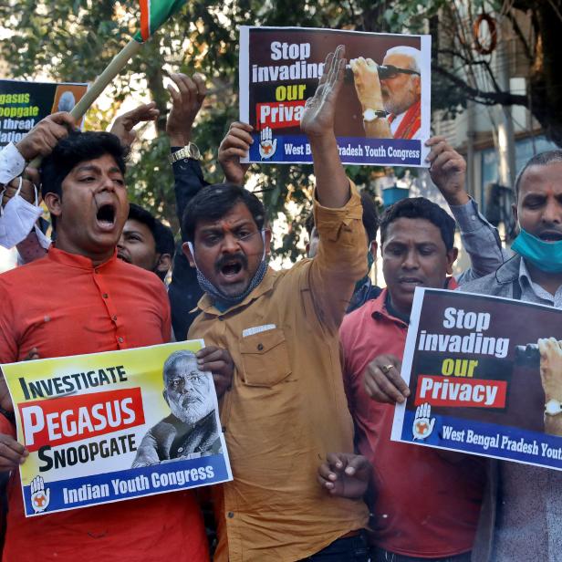 Supporters of India's main opposition Congress party hold placards as they shout slogans against India's PM Modi during a protest, in Kolkata