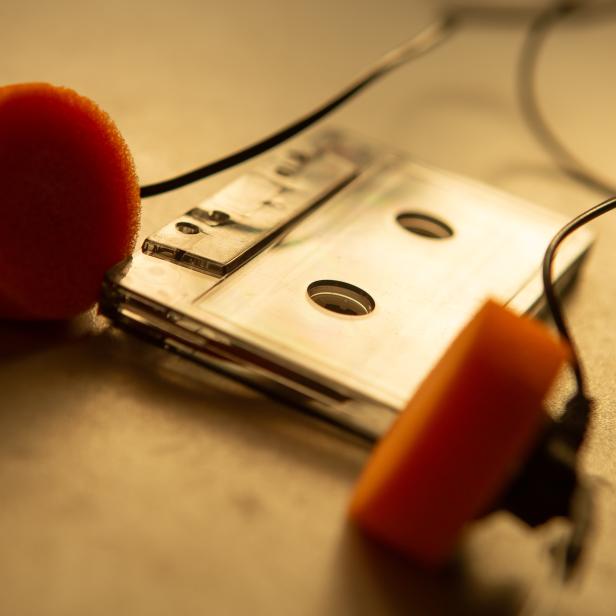 Music listening concept. Vintage cassette tape, audio player and headphones. retro color