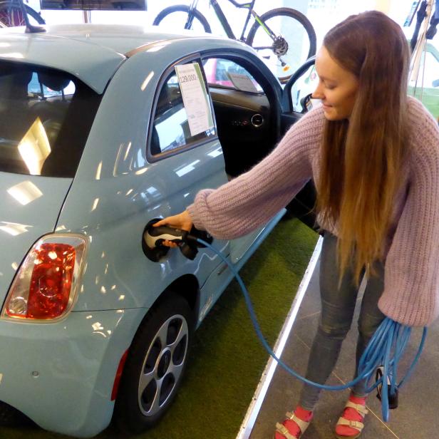 Skram of Buddy Electric car dealer company shows the charging of a second-hand Fiat 500e in Oslo