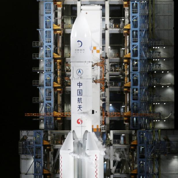 FILE PHOTO: The Long March-5 Y5 rocket, carrying the Chang'e-5 lunar probe, is seen before taking off from Wenchang Space Launch Center, in Wenchang