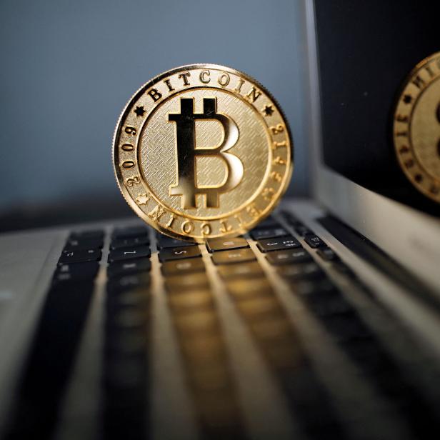 FILE PHOTO: A bitcoin is seen in an illustration picture taken at La Maison du Bitcoin in Paris