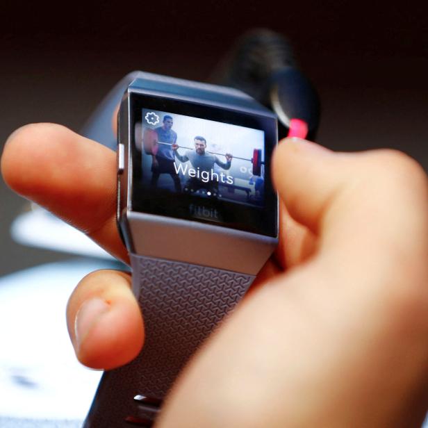 FILE PHOTO: A visitor uses a Fitbit Ionic watch at the IFA Electronics Show in Berlin