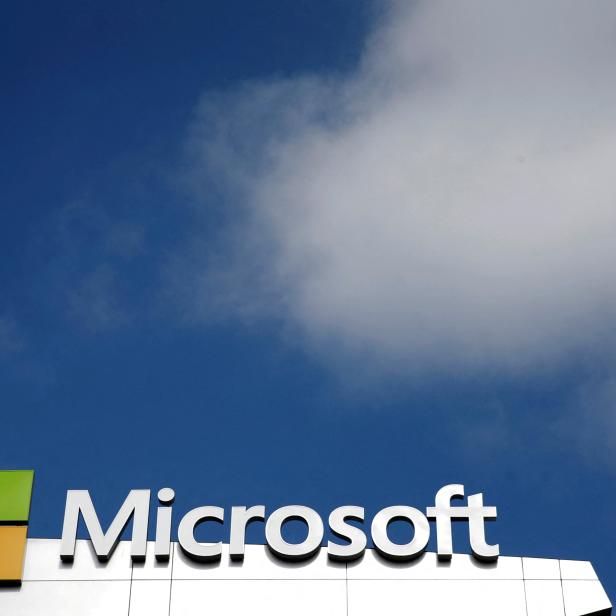 FILE PHOTO: A Microsoft logo is seen next to a cloud in Los Angeles