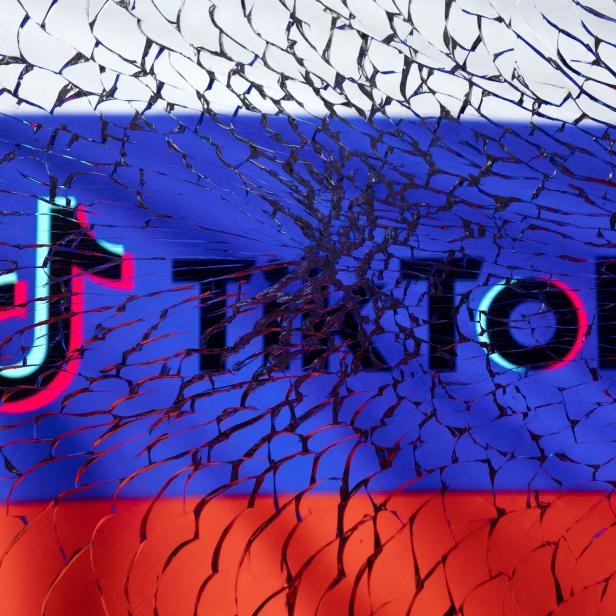 Illustration shows TikTok logo and Russian flag through broken glass