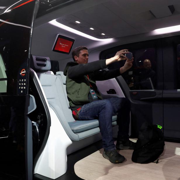 FILE PHOTO: An attendee takes a selfie inside a Cruise Origin autonomous vehicle during its unveiling in San Francisco