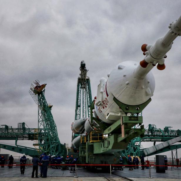 The Soyuz-2.1a rocket booster with the Soyuz MS-21 spacecraft is rolled out onto the launchpad at the Baikonur Cosmodrome