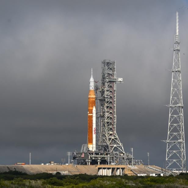 Morning fog lifts as NASAs next-generation moon rocket, the Space Launch System (SLS) rocket sits at launch pad 39-B