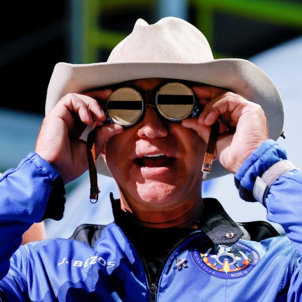 FILE PHOTO: Blue Origin's Bezos wears goggles owned by Amelia Earhart which he carried into space