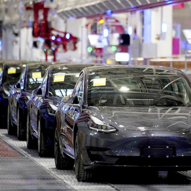 FILE PHOTO: FILE PHOTO: Tesla China-made Model 3 vehicles are seen during a delivery event at the carmaker's factory in Shanghai, China