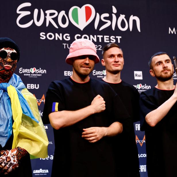 Kalush Orchestra from Ukraine pose for photographers after winning the 2022 Eurovision Song Contest