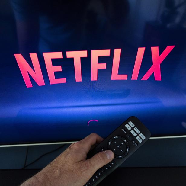 A Netflix logo is shown on a TV screen ahead of a Swiss vote, in this illustration