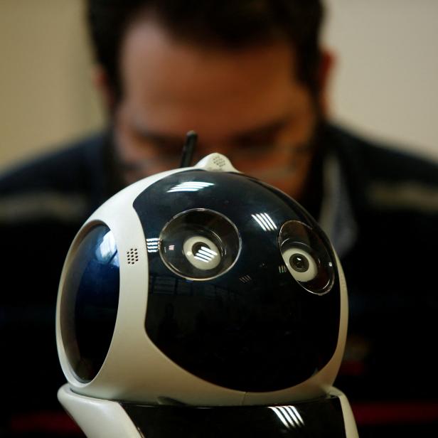 FILE PHOTO: A research support officer and PhD student works on his artificial intelligence project to train robots to autonomously carry out various tasks, at the Department of Artificial Intelligence at the University of Malta in Msida