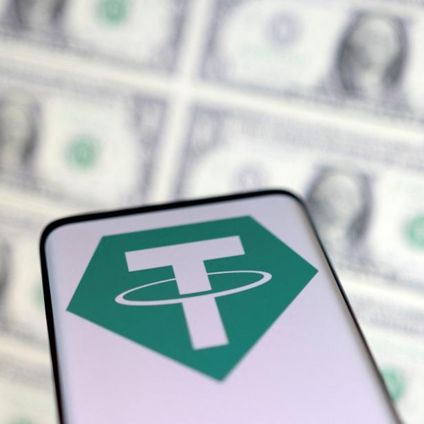 Illustration shows Tether logo and U.S. dollars