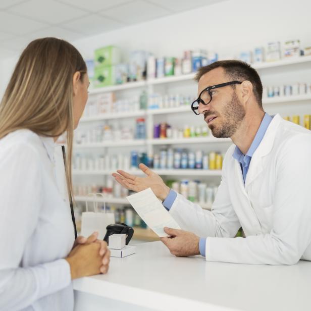 Pharmacist talking to a customer