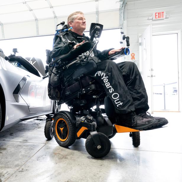 A handout image of Quadriplegic former IndyCar driver Sam Schmidt alongside his customised Chevrolet Corvette, in Nashville