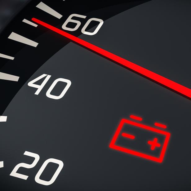 Discharged battery warning light in car dashboard. 3D rendered illustration.