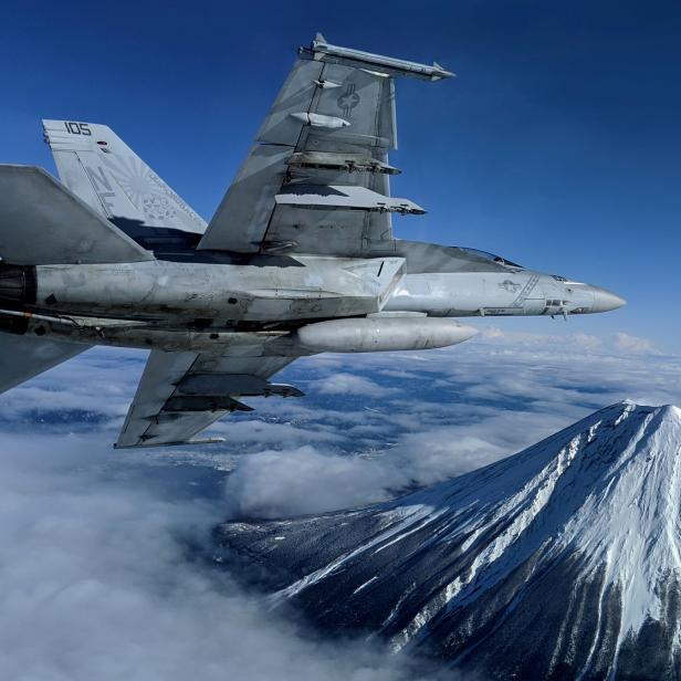 FILE PHOTO: A U.S. Navy F/A-18F Super Hornet flies past Mount Fuji