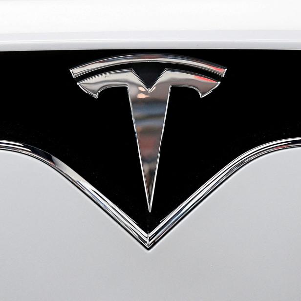 FILE PHOTO: The Tesla logo is seen on a car at Tesla Motors' new showroom in Manhattan's Meatpacking District in New York