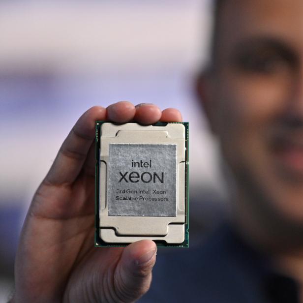 Handout photo of Navin Shenoy, executive vice president and general manager of the data platforms group at Intel Corp, holding one of the company's "Ice Lake" data center chips