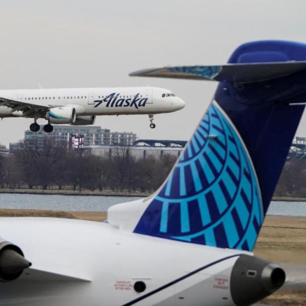 An Alaska Airlines aircraft lands at Reagan National Airport in Arlington, Virginia