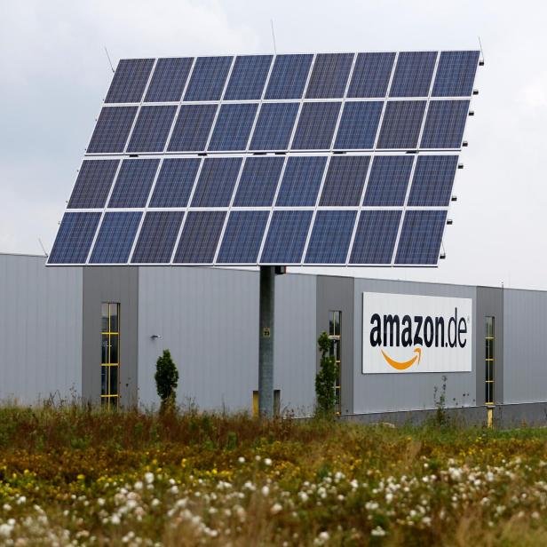 FILE PHOTO: Solar panels stand in front of the Amazon distribution centre in Bad Hersfeld