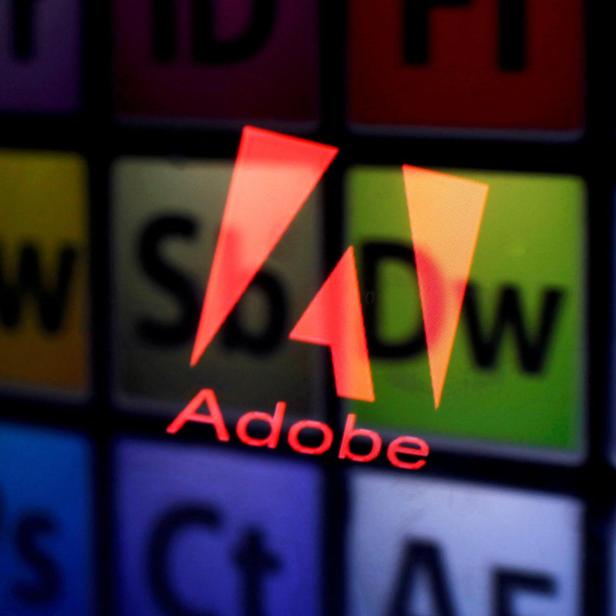 FILE PHOTO: FILE PHOTO: Picture illustration shows Adobe logo and Adobe products reflected on a monitor display and an iPad screen, in central Bosnian town of Zenica