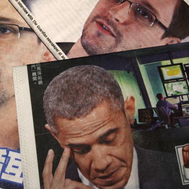 Photos of Edward Snowden, a contractor at the National Security Agency (NSA), and U.S. President Barack Obama are printed on the front pages of local English and Chinese newspapers in Hong Kong in this illustration photo June 11, 2013. Snowden, who leaked details of top-secret U.S. surveillance programs, dropped out of sight in Hong Kong on Monday ahead of a likely push by the U.S. government to have him sent back to the United States to face charges. REUTERS/Bobby Yip (CHINA - Tags: POLITICS MEDIA)