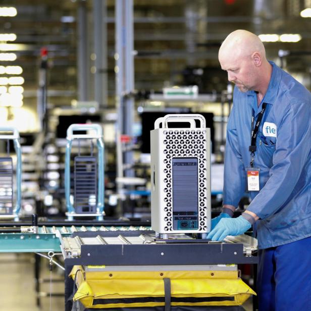 Flextronics International Apple factory employees work on Apple Mac Pro computer assembly in Austin, TX