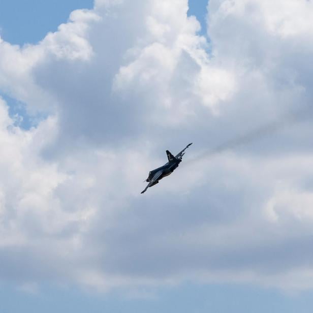 A Russian Sukhoi Su-25 plane with a Z sign flies near the settlement of Olenivka