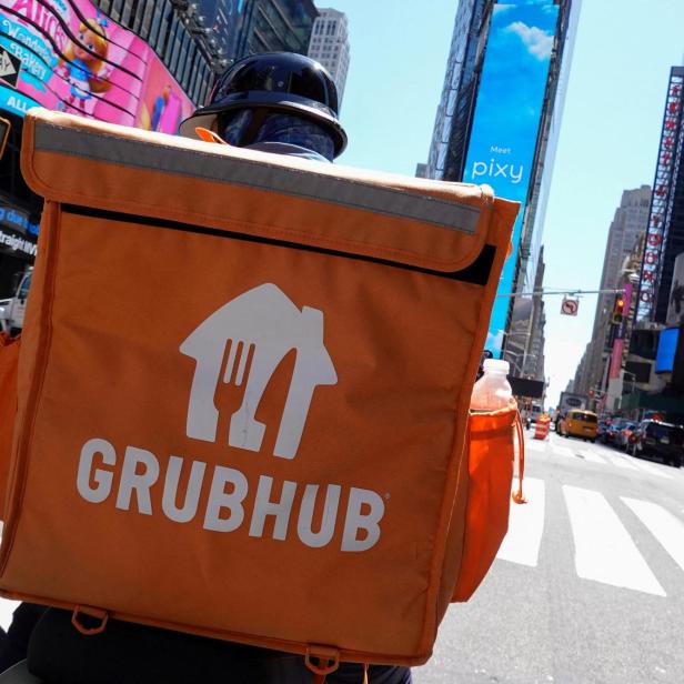 FILE PHOTO: FILE PHOTO: A Grubhub delivery person rides in Manhattan, New York City