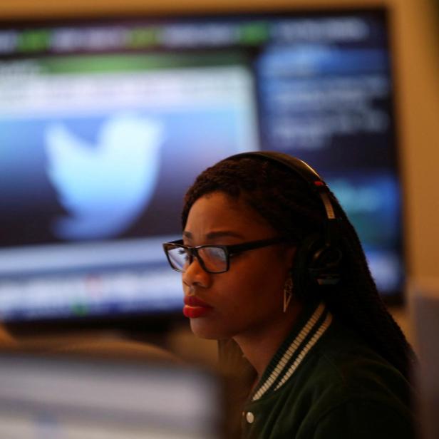 FILE PHOTO: A Twitter employee works at a computer at the company's headquarters in San Francisco