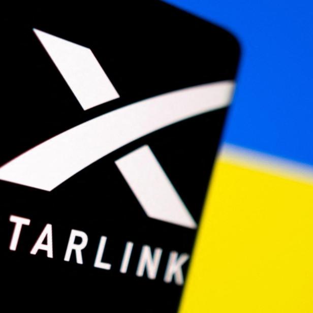 FILE PHOTO: Illustration shows Starlink logo and Ukraine flag