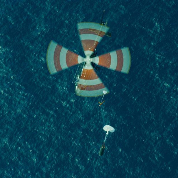 Helicopter latches onto a dummy rocket stage standing in for Rocket Lab's Electron rocket booster