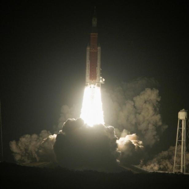 NASA's next-generation moon rocket, the Space Launch System (SLS) rocket with the Orion crew capsule, lifts off from launch complex 39-B at Cape Canaveral