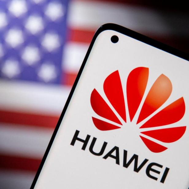 FILE PHOTO: Smartphone with a Huawei logo is seen in front of U.S. flag in this illustration