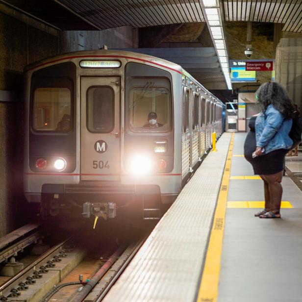 Los Angeles Metro commuters wait for their train during the outbreak of the coronavirus disease (COVID-19) in Los Angeles, California