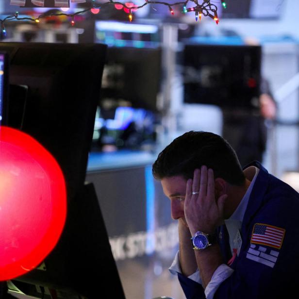 A trader works on the trading floor at the New York Stock Exchange (NYSE) in New York City