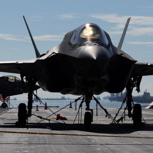 FILE PHOTO: Lockheed Martin F-35 Lightning II aircrafts are seen on the flight deck of amphibious assault ship USS Tripoli (LHA-7) at Changi Naval Base in Singapore