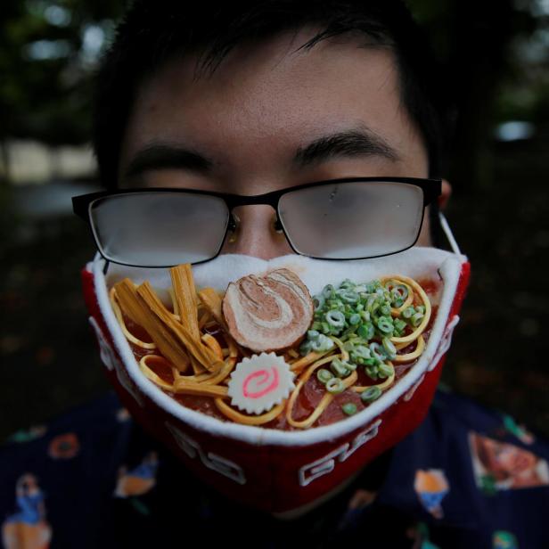 Japanese designer Takahiro Shibata's poses for a photo at a park in Yokohama